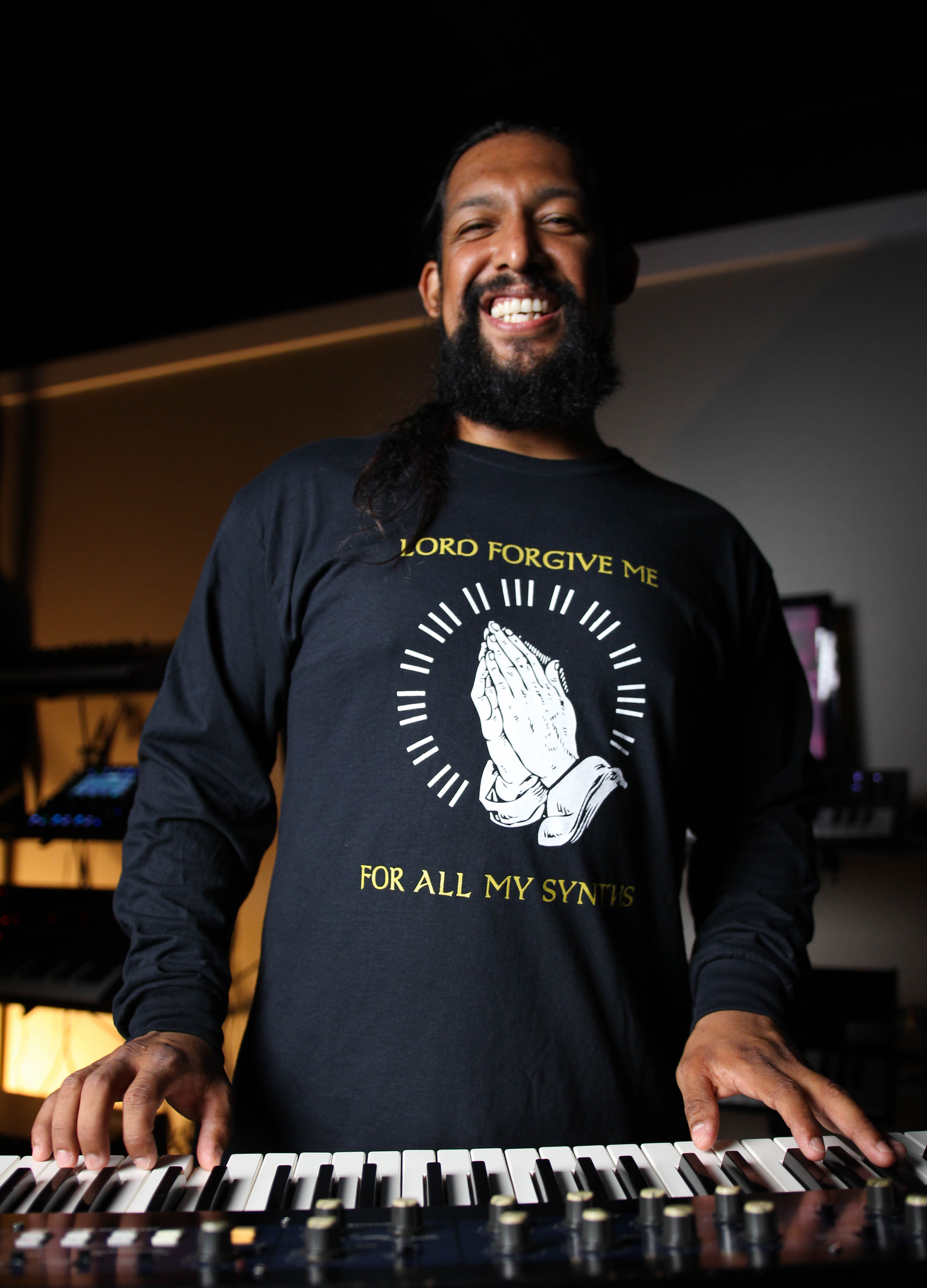 Black long-sleeve shirt with Lord Forgive Me for All My Synths logo